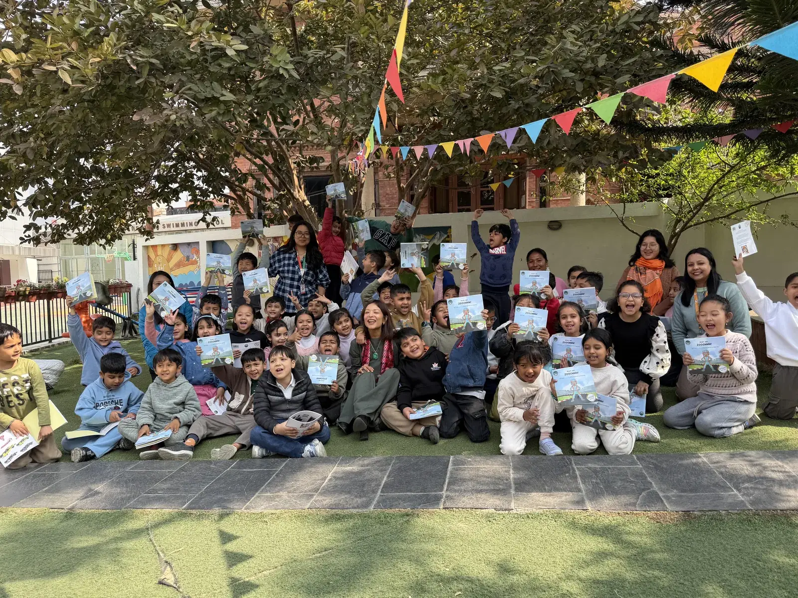 Children following along at a Ready, Set, Zooommm read-aloud session